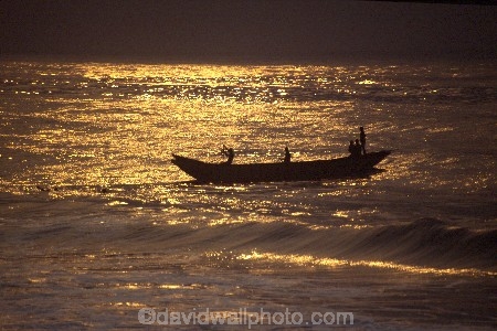 Fisherman;african;fishermen;fishing;silhouette;sunset;sunrise;ocean;sea;atlantic;elmina;ghana;ghanain;west-africa;sahel;light;boat;boats;fishing-boat;fishing-boats;dawn