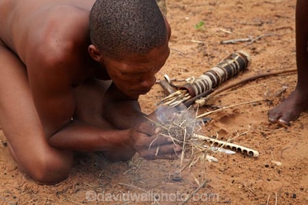 Africa;African;African-people;Bushman;Bushman-Living-Museum;Bushmanland;Bushmen;cultural;cultural-exchange;culture;demonstration;demonstrations;fire;fire-craft;fire-lighting;fire-lighting-with-sticks;Fire-making;fire-starting;fire-starting-with-sticks;fires;forager-society;Grashoek;Grashoek-Living-Museum;Grashoek-village;hunter_gatherer;Hunting-and-gathering;Ju-Hoansi_San-Living-Museum;JuHoansi;JuHoansi_San-men;JuHoansi_San-people;Living-Museum;Living-Museum-of-the-Ju-Hoansi_San;Living-Museum-of-the-JuHoansi_San;Living-Museums;making-fire;making-fires;Namibia;Namibia,-Africa;Otjozondjupa-District;Otjozondjupa-Region;people;person;rubbing-sticks-together;San;San-Living-Museum;San-people;smoke;Southern-Africa;tradition;traditional;Traditional-Bushman-Culture;traditional-clothing;traditional-costume;traditional-dress;traditional-fire-lighting;Traditional-San-Culture;tribe