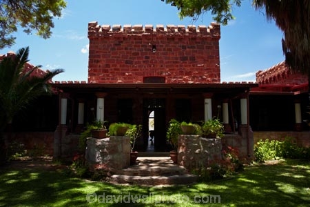 1908;1909;Africa;building;buildings;castle;castles;courtyard;courtyards;Duweseb-Castle;Duwiseb-Castle;Duwisib-Castle;grass;green;heritage;historic;historic-building;historic-buildings;historical;historical-building;historical-buildings;history;lush;Maltahohe;MaltahÃ¶he;Namib-Desert;Namibia;old;Schloss-Duwisib;shade;shady;Southern-Africa;stone-architecture;stone-building;stone-builidings;tradition;traditional;tree;trees;yard