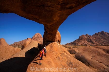 Africa;archway;archways;bald-granite-peak;bald-granite-peaks;bornhardts;boy;boys;child;children;Erongo-Region;families;family;family-holiday;family-holidays;female;geological;geology;girl;girls;Groot-Spitzkop;holiday;holidays;inselberg;inselbergs;monadnock;monadnocks;mother;Namib-Desert;Namibia;Natural-Arch;Natural-Arches;natural-bridge;natural-bridges;natural-geological-formation;natural-geological-formations;Natural-Rock-Arch;natural-rock-arches;natural-rock-archs;natural-rock-bridge;natural-rock-bridges;people;person;Pondok;Pondok-Mountain;Pondok-Mountains;Pondoks;rock;rock-arch;rock-arches;rock-formation;rock-formations;rock-outcrop;rock-outcrops;rock-tor;rock-torr;rock-torrs;rock-tors;rocks;Southern-Africa;Spitzkop;Spitzkoppe;stone;tourism;tourist;tourists;unusual-natural-feature;unusual-natural-features;unusual-natural-formation;unusual-natural-formations;wilderness;wilderness-area;wilderness-areas;woman