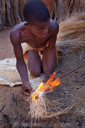 Africa;African;African-people;cultural;cultural-exchange;culture;Damara-culture;Damara-Living-Museum;Damara-Living-Village;Damara-Village;Damaraland;Damaraland-Living-Museum;demonstration;demonstrations;fire;fire-craft;fire-lighting;fire-lighting-with-sticks;Fire-making;fire-starting;fire-starting-with-sticks;fires;flame;flames;Kunene-District;Kunene-Region;Living-Museum;Living-Museums;making-fire;making-fires;Namib-Desert;Namibia;people;person;rubbing-sticks-together;Southern-Africa;tradition;traditional;traditional-clothing;traditional-costume;traditional-dress;Twyfelfontein