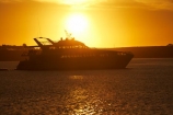 Australasian;Australia;Australian;boat;boats;cruise;cruises;dusk;evening;Gordon-River-Cruise-Boat;Gordon-River-Cruises;Island-of-Tasmania;launch;launches;Macquarie-Harbor;Macquarie-Harbour;nightfall;orange;pleasure-boat;pleasure-boats;sky;State-of-Tasmania;Strahan;Strahan-Harbor;Strahan-Harbour;sunset;sunsets;Tas;Tasmania;The-West;tour-boat;tour-boats;tourism;tourist;tourist-boat;tourist-boats;twilight;water;West-Tasmania;Western-Tasmania