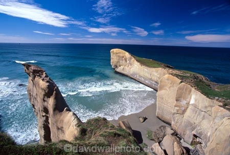 cliff;cliffs;dunedin;tunnel-beach;bluff;bluffs;precipice;person;;high;sea-ocean;pacific;coastline;coast;rock;beaches;wave;waves
