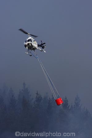 air-craft;aircraft;aircrafts;aviating;aviation;aviator;aviators;Bel-Jet-Ranger;Bel-Jet-Rangers;Bell-206B;Bell-Jetranger;Bell-Jetrangers;bucket;buckets;chopper;choppers;douse;Dunedin;emergency;fire;fire-fighters;fire-fighting;fire_fighting;firefighting;fires;flight;flights;fly;flyer;flyers;flying;Forest-Fire;Forest-Fires;Helicopter;Helicopters;Helicopters-Otago;Jet_ranger;Jet_rangers;monsoon-bucket;monsoon-buckets;N.Z.;New-Zealand;NZ;pilot;pilots;pine;pine-forest;pine-forests;pine-tree;pine-trees;pines;rotor;S.I.;SI;sky;smoke;smokey;South-Island;water-biuckets;water-bucket