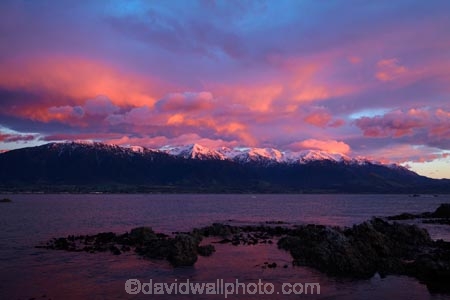 alpenglo;alpenglow;alpine;alpinglo;alpinglow;break-of-day;calm;cloud;clouds;coast;coastal;coastline;coastlines;coasts;color;colors;colour;colours;dawn;dawning;daybreak;first-light;Kaikoura;Kaikoura-Coast;Kaikoura-Range;Kaikoura-Ranges;Marlborough;morning;mountain;mountainous;mountains;mt;New-Zealand;NZ;ocean;oceans;orange;Pacific-Ocean;pink;placid;quiet;reflected;reflection;reflections;S.I.;sea;seas;Seaward-Kaikoura-Range;Seaward-Kaikoura-Ranges;serene;shore;shoreline;shorelines;shores;smooth;snow;snow-capped;snowy;South-Is;South-Island;Sth-Is;still;sunrise;sunrises;sunup;tranquil;twilight;water