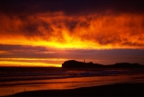 light-house;lighthouses;light-houses;lighthouse;coast;coastline;coastal;shoreline;shore;beach;beaches;headland;promontory;color;colour;colors;colours;orange;dawn;sunrise;Castle-Point-Lighthouse;Wairarapa;North-Island;Pacific;ocean