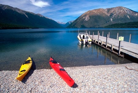 lakes;lake;water;kayak;kayaks;kayaking;bush;person;people;tranquil;tranquility;peaceful;peace;peacefulness;beach;beaches;colour;colours;color;colors;yellow;red;blue;green;aqua;clear;see_through;pure;boat;boats;jetty;jetties;wharf;wharves;pier;piers;Lake-Rotoiti;Nelson-Lakes-National-Park;nelson-lakes;national-parks