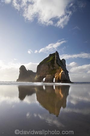 archway;Archway-Is;Archway-Is.;Archway-Island;Archway-Islands;archways;beach;beaches;calm;coast;coastal;coastline;foreshore;geological;geology;N.Z.;Nelson-Region;New-Zealand;North-West-Nelson-Region;NZ;placid;quiet;reflection;reflections;rock;rock-archway;rock-archways;rock-formation;rock-formations;rock-outcrop;rock-outcrops;rock-tor;rock-torr;rock-torrs;rock-tors;rocks;S.I.;sand;sandy;serene;shore;shoreline;SI;smooth;South-Is.;South-Island;still;stone;Tasman-Sea;tranquil;water;Wharariki-Beach