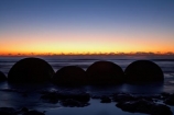 beach;beaches;boulder;break-of-day;coast;coastal;coastline;coastlines;coasts;concretion;dawn;dawning;daybreak;first-light;formation;geological;geology;marble;marbles;Moeraki;Moeraki-Boulder;Moeraki-Boulders;morning;N.Z.;New-Zealand;North-Otago;NZ;ocean;Otago;rock;rocks;round;S.I.;sand;sea;sedementary;shore;shoreline;shorelines;shores;SI;South-Island;sphere;sunrise;sunrises;sunup;twilight;Waikati-District;Waitaki-District