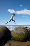 action;beach;beaches;boulder;child;children;coast;coastal;coastline;coastlines;coasts;concretion;foreshore;formation;geological;geology;girl;girls;horizon;jump;jumping;kid;kids;leap;leaping;leaps;little-girl;little-girls;marble;marbles;Moeraki;Moeraki-Boulder;Moeraki-Boulders;N.Z.;New-Zealand;North-Otago;NZ;ocean;Otago;rock;rocks;round;S.I.;sand;sea;sedimentary;shore;shoreline;shorelines;shores;SI;sky;South-Is;South-Is.;South-Island;sphere;unusual-geologocal-feature;unusual-geologocal-features;unusual-natural-feature;unusual-natural-features;unusual-rock;unusual-rocks;Waikati-District;Waitaki-District;Waitaki-Region;water;young-girl;young-girls