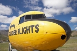 Glider-Flights-Sign;N.Z.;New-Zealand;North-Otago;NZ;Omarama;Otago;plane;planes;S.I.;SI;sign;signs;South-Is.;South-Island;vintage-plane;vintage-planes;Waitaki-District;Waitaki-Region;Waitaki-Valley;yellow