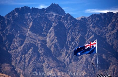 Queenstown;Central-Otago;The-Remarkables;remarkables;mountain;mountains;rocky;point;points;peak;peaks;peaked;jagged;flag;flags;new-zealand;icon;south-island;nation;nationality;identity;flag-pole;wind;windy