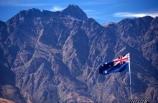 Queenstown;Central-Otago;The-Remarkables;remarkables;mountain;mountains;rocky;point;points;peak;peaks;peaked;jagged;flag;flags;new-zealand;icon;south-island;nation;nationality;identity;flag-pole;wind;windy
