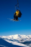 chair-lift;holiday;lift;seated;sitting;ski;skier;skiers;skiing;skis;transport;transportation;vacation