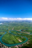 winding;rural;farmland;pasture;pastures;fields;field;agriculture;fertile;paddocks;paddock;farmland;pastureland;arable;meadows;colour;color;green;New-Zealand;clouds;s;aerials;rivers;bend;bends