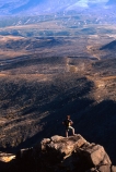 crater;figure;mountain;outcrop;peak;person;remote;rock;rocky