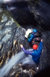 rock;rocks;rocky;climber;climbers;water;rushing-water;canyon;deep;stream;flow;flowing;helmet;helmets;safety-gear;safety-equipment;wet;descent;descend;challenge