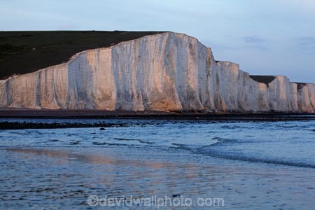 afternoon-light;bluff;bluffs;Britain;British-Isles;calm;chalk-cliff;chalk-cliffs;chalk-downland;chalk-downlands;chalk-downs;chalk-formation;chalk-formations;chalk-headland;chalk-headlands;chalk-layer;chalk-layers;cliff;cliffs;coast;coastal;coastline;coastlines;coasts;Cretaceous-chalk-layer;Cuckmere-Beach;Cuckmere-Haven;down;downland;downlands;downs;East-Sussex;England;English;English-Chanel;eroded;erosion;Europe;foreshore;formation;formations;G.B.;GB;geological;geological-formation;geological-formations;geology;Great-Britain;image;images;late-light;layer;layering;layers;limestone;low-tide;low-tides;natural;natural-landscape;natural-landscapes;ocean;oceans;photo;photos;placid;quiet;reflection;reflections;rock-formation;rock-formations;S.E.-England;SE-England;sea;Seaford;seas;sedimentary-layer;sedimentary-layers;serene;Seven-Sisters;Seven-Sisters-Chalk-Cliffs;Seven-Sisters-Cliffs;Seven-Sisters-Country-Park;shore;shoreline;shorelines;shores;smooth;South-Downs;South-Downs-N.P.;South-Downs-National-Park;South-Downs-NP;South-East-England;Southern-England;steep;still;stone;strata;stratum;Sussex;The-Seven-Sisters;tidal;tide;tides;tranquil;U.K.;UK;United-Kingdom;unusual-natural-feature;unusual-natural-features;unusual-natural-formation;unusual-natural-formations;water;white-chalk-cliff;white-chalk-cliffs;White-Cliff;white-cliffs
