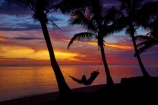 coconut-palm;coconut-palm-tree;coconut-palm-trees;coconut-palms;Coral-Coast;dusk;evening;female;Fij;Fiji-Islands;hammock;hammocks;Korotogo;nightfall;orange;Pacific;Pacific-Ocean;palm;palm-tree;palm-trees;palms;people;person;Sigatoka;silhouette;silhouettes;sky;South-Pacific;sunset;sunsets;tourism;tourist;tourists;tropical-island;tropical-islands;twilight;Viti-Levu;Viti-Levu-Island;woman;women
