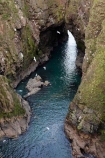 Aberdeenshire;bluff;bluffs;Britain;British-Isles;Buchan;Bullers-of-Buchan;cave;cavern;caverns;caves;cliff;cliffs;coast;coastal;coastline;coastlines;coasts;eroded;erosion;formation;formations;G.B.;GB;geological;geological-formation;geological-formations;geology;Great-Britain;grotto;grottos;littoral-cave;littoral-caves;natural;natural-arch;natural-arches;natural-bridge;natural-bridges;natural-geological-formation;natural-geological-formations;natural-landscape;natural-landscapes;Peterhead;roch-arches;rock;rock-arch;rock-arches;rock-formation;rock-formations;rocks;Scotland;sea-arch;sea-arches;sea-cave;sea-caves;stone;U.K.;UK;United-Kingdom;unusual-natural-feature;unusual-natural-features