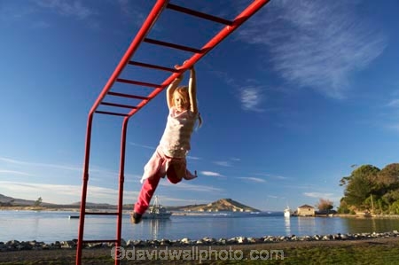 action;activity;caucasian;child;Child-Playing;childhood;children;excercise;excercising;fun;girl;girls;gymnastics;hang;hanging;jungle-gym;Karitane;Monkey-Bars;New-Zealand;Otago;outdoors;park;parks;people;person;play;playground;playgrounds;playing;plays;recreation-leisure;South-Island;swing;swinging;young