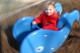 swing;swings;swinging;seesaw;see_saw;seesaws;see_saws;whale;blue;blue-whale;red;girl;little;child;children;play;playing;playground;play_ground;play-ground;playgrounds;play_grounds;play-grounds;speed;blurr;blurred;blurry;fast;motion;zoom;zoomed;zooms;zooming;outdoor;outdoors;outside;playtime;fun;moving;movement;childhood;happiness;happy;joy;kid;kids;daughter