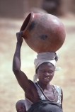 africa;african;africans;black;ethnic;people;person;persons;mother;portrait;portraits;culture;cultural;cultures;tribe;tribes;tribal;indigenous;native;woman;cameroun;camerouns;cameroon;cameroons;pot;clay-pot;head;carry;carrying;heavy;baby;babies;lady;earthenware;earthen