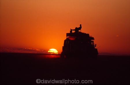overland-truck;Kalahari;Kalahari-Desert;Botswana;Southern-Africa;Africa;African;silhouette;silhouettes;overlander;trucks;overlanders;vehicle;people;person;sunset;sunsets;sundown;color;colors;colour;colours;orange;desert;deserts;camp;camping;relax;relaxing;sundowner;africa;wilderness;4x4;4wd;four-wheel-drive