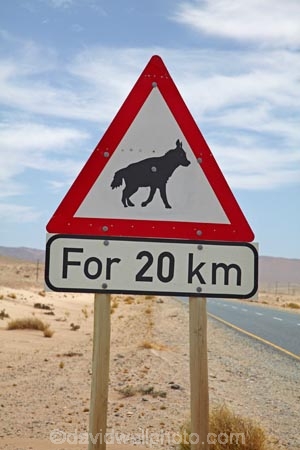 20km;Africa;B4-road;Brown-Hyena;driving;highway;highways;Hyaena-brunnea;Luderitz;Namib-Desert;Namibia;open-road;open-roads;Parahyaena-brunnea;road;road-sign;road-signs;road-trip;road-warning-sign;road-warning-signs;roads;sign;signs;Southern-Africa;Southern-Namibia;straight;Strandjut;Strandwolf;transport;transportation;travel;traveling;travelling;trip;warning-sign;warning-signs;wildlife-sign;wildlife-signs