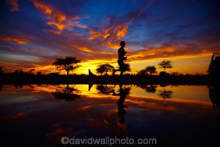 Africa;break-of-day;calm;dawn;dawning;daybreak;Etosha-N.P.;Etosha-National-Park;Etosha-NP;first-light;game-park;game-parks;game-reserve;game-reserves;jogger;joggers;morning;Namibia;national-park;national-parks;Okaukuejo;Okaukuejo-camp-ground;Okaukuejo-camp-site;Okaukuejo-campground;Okaukuejo-campsite;Okaukuejo-Rest-Camp;orange;placid;quiet;reflected;reflection;reflections;runner;runners;serene;smooth;Southern-Africa;still;sunrise;sunrises;sunup;tranquil;twilight;water;wildlife-park;wildlife-parks;wildlife-reserve;wildlife-reserves