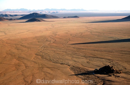 wilderness-camping;safier-farm;namib-desert;namibia;namibian;africa;african;camp;camping;camper;campers;plain;plains;rock;rocks;mound;mounds;sparse;desert;deserts;deserted;arid;empty;bare;shadow;shadows;horizon;overland;overlanding;travel;vast;empty