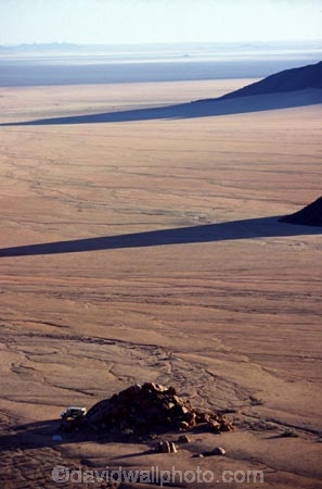 wilderness-camping;safier-farm;namib-desert;namibia;namibian;africa;african;camp;camping;camper;campers;plain;plains;rock;rocks;mound;mounds;sparse;desert;deserts;deserted;arid;empty;bare;shadow;shadows;horizon;overland;overlanding;travel;vast;empty