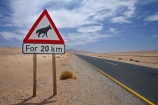 20km;Africa;B4-road;Brown-Hyena;driving;highway;highways;Hyaena-brunnea;Luderitz;Namib-Desert;Namibia;open-road;open-roads;Parahyaena-brunnea;road;road-sign;road-signs;road-trip;road-warning-sign;road-warning-signs;roads;sign;signs;Southern-Africa;Southern-Namibia;straight;Strandjut;Strandwolf;transport;transportation;travel;traveling;travelling;trip;warning-sign;warning-signs;wildlife-sign;wildlife-signs