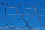Africa;barbed-wire;barbed-wire-fence;barbed_wire;blue-sky;Cape-Town;fence;fences;gaol;gaols;island;islands;jail;jails;prison;prison-fence;prison-fences;prison-island;prisons;razor-wire;razor-wires;Robben-Island;Robben-Island-Gaol;Robben-Island-Jail;Robben-Island-Prison;Robbeneiland;S.A.;security;security-fences;South-Africa;Southern-Africa;Sth-Africa;Table-Bay;Western-Cape;Western-Cape-Province;wire;wires