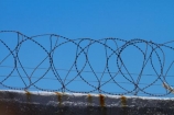 Africa;barbed-wire;barbed-wire-fence;barbed_wire;blue-sky;Cape-Town;fence;fences;gaol;gaols;island;islands;jail;jails;prison;prison-fence;prison-fences;prison-island;prisons;razor-wire;razor-wires;Robben-Island;Robben-Island-Gaol;Robben-Island-Jail;Robben-Island-Prison;Robbeneiland;S.A.;security;security-fences;South-Africa;Southern-Africa;Sth-Africa;Table-Bay;Western-Cape;Western-Cape-Province;wire;wires