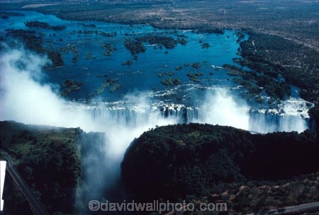 Victoria-Falls;Zambezi-River;Zimbabwe;Zambia;Africa;African;Southern-Africa;aerial;waterfall;waterfalls;water;nature;natural;wonder-of-the-world;world-wonder;seven-natural-wonders-of-the-wo;mist;misty;spary;refraction;high;power;powerful;vertical;;flow;chasm;global-warming;gush;cliff;cliffs;bluff;bluffs;crevasse;crevasses;falling;falls;fall;phenomena;phenomenon;precipice;precipices;aerial;aerials