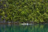 Misool;Raja-Ampat;Indonesia;Asia;Southeast-Asia;South-East-Asia;Western-Indonesia;Southwest-Papua;West-Papua;inner-archipelago;forest;forests;jungle;jungles;tropical-jungle;tropical;tropical-jungle;tropical-forest;tropical-forests;rainforest;rainforests;reflection;reflections;Longboat;longboats;narrow-boat;narrow-boats;boat;boats;motor-boat.-motorboat;motor-boats;motorboats;sampan;Misool-archipelago