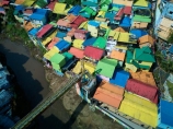 Indonesia;aerial;aerial-photo;aerial-photograph;aerial-photographs;aerial-photography;aerial-photos;aerial-view;aerial-views;aerials;drone-aerial;drone;Malang;Java;East-Java;Indonesia;Brantas-River;Roof;roofs;rooves;Kampung-Warna-Warni;Kampung;Warna-Warni;Kampung-Warna_Warni;Warna_Warni;bridge;bridges;pedestrian-bridge;pedestrian-bridges;tourism;travel;Asia;South-East-Asia;Southeast-Asia