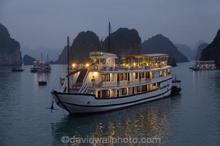 Asia;boat;boats;calm;cruise-boat;cruise-boats;cruising;dusk;evening;Ha-Long-Bay;Halong-Bay;Halong-Phoenix-Boat;Halong-Phoenix-Cruiser-Boat;Halong-Phoenix-Cruiser-Tour-Boat;karst-landscape;light;lighting;lights;limestone-karsts;night;nightfall;North-Vietnam;Northern-Vietnam;placid;Qung-Ninh-Province;Quang-Ninh-Province;quiet;reflected;reflection;reflections;serene;smooth;South-East-Asia;Southeast-Asia;still;tour-boat;tour-boats;tourism;tourist;tourist-boat;tourist-boats;tourists;tranquil;travel-destination;UN-world-heritage-area;UN-world-heritage-site;UNESCO-World-Heritage-area;UNESCO-World-Heritage-Site;united-nations-world-heritage-area;united-nations-world-heritage-site;Vnh-H-Long;Vietnam;Vietnamese;water;world-heritage;world-heritage-area;world-heritage-areas;World-Heritage-Park;World-Heritage-site;World-Heritage-Sites