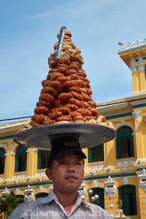 Asia;Asian;building;buildings;carrying-on-head;Central-Post-Office;chief-post-office;cities;city;District-1;District-One;food;H.C.M.-City;H-ChÃ­-Minh;HCM;HCM-City;heritage;historic;historic-building;historic-buildings;historical;historical-building;historical-buildings;history;Ho-Chi-Minh;Ho-Chi-Minh-Central-Post-Office;Ho-Chi-Minh-City;Ho-Chi-Minh-Post-Office;main-post-office;male;males;man;men;old;pastries;pastry;people;person;Post-Office;Saigon;Saigon-Central-Post-Office;Saigon-Post-Office;seller;sellers;South-East-Asia;Southeast-Asia;street-food;street-vendor;street-vendors;tradition;traditional;tray-of-pastries;Vietnam;Vietnamese