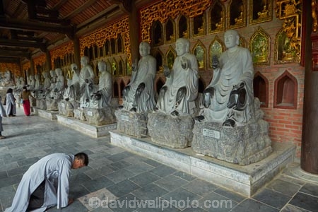 alabaster;Arhat;Arhats;Asia;Bai-Dinh-Buddist-Temple;Bai-Dinh-Mountain;Bai-Dinh-Temple;Bai-Dinh-Temple-Spiritual-and-Cultural-Complex;Buddhist-Temple;Buddhist-Temples;Buddism;Buddist;Chua-Bai-Dinh;cloister;cloisters;corridor;corridors;Gai-Vien-District;gold;hall;halls;man;marble;men;Ninh-Binh;Ninh-Binh-Province;Ninh-Bình-province;Northern-Vietnam;people;person;place-of-worship;places-of-worship;pray;prayer;praying;religion;religions;religious;South-East-Asia;Southeast-Asia;statue;statues;stone;stone-statues;temple;temples;Vietnam;Vietnamese