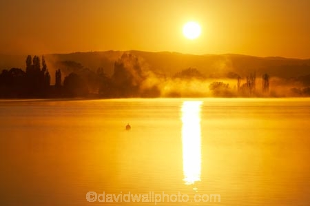 A.C.T.;ACT;Australia;Australian-Capital-Territory;break-of-day;calm;Canberra;capital;capitals;dawn;dawning;daybreak;East-Basin;first-light;lake;Lake-BG;Lake-Burley-Griffin;lakes;mist;mists;misty;morning;orange;placid;quiet;reflection;reflections;serene;silhouette;silhoutettes;smooth;still;sunrise;sunrises;sunup;tranquil;twilight;water