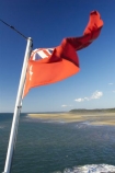 australasia;Australia;australian;Australian-Red-Ensign;blow;blowing;cruise;ferries;ferry;Flag;flags;flutter;Fraser-Island;great-sandy-n.p.;great-sandy-national-park;great-sandy-np;icon;icons;Maritime;maritime-flag;Queensland;red-ensign;star;stars;symbol;symbols;union-jack;wind;windy