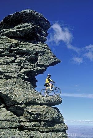 on-the-edge;bike;cycle;cyclist;biker;bikes;cycles;bicycle;bicycles;outcrop;outcrops;-rocks;high-country;cliff;cliffs;bluff;bluffs;danger;dangerous;exciting;adventure;sports;overhang;sky;mountain;biking;cycling;