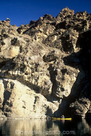 cliff;cliffs;bluff;bluffs;rock;rocks;kayak;kayaks;kayaker;kayaking;canoe;canoes;canoeing;lakes;still;stillness;calm;calmness;reflection;reflections;tranquil;tranquility;water;outcrop;outcrops;schist
