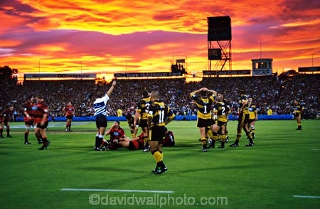canterbury-crusaders;clouds;color;colors;colour;colours;dusk;football;lancaster-park;orange;rugby;sky;sport;sunset;wellington-huricans