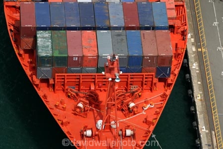 ship;container;containers;orange;red;row;rows;stack;stacks;stacked;stacking;rope;ropes;dock;docked;docking