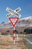 cross;crosses;give-way-sign;level-crossing;level-crossings;Middlemarch;N.Z.;New-Zealand;NZ;Otago;rail;rail-crossing;rail-crossings;railroad;railroads;railway;railway-crossing;railway-crossings;railways;range;ranges;Rock-amp;-Pillar-Range;S.I.;SI;sign;signage;signs;snow-capped;snow_capped;snowcapped;snowy;South-Is.;South-Island;Strath-Taieri;Sutton;tracks;train;trains;transport;transportation;twilight;warning;warning-sign;warning-signs;x
