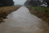 bad-weather;brook;brooks;country;countryside;creek;creeks;deluge;dike;dikes;dirty;dirty-water;Dunedin;dyke;dykes;embankment;embankments;flood;flood-bank;flood-banks;flood-water;flood-waters;floodbank;floodbanks;flooding;floods;floodwater;floodwaters;flow;high-water;inundate;levee;levees;meadow;meadows;Mosgiel;N.Z.;New-Zealand;NZ;on-flood;Otago;paddock;paddocks;pasture;pastures;rural;S.I.;SI;Silver-Stream;Silverstream;South-Is.;South-Island;stopbank;stopbanks;stream;streams;swollen-river;Taieri;Taieri-Plain;Taieri-Plains;water;waterway;waterways;weather;wet