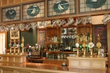 bar;beer;wine;spirits;alcohol;jugs;jug;tap;taps;handle;handles;bottle;bottles;wood;bench;stained-glass;pub;historic;historical